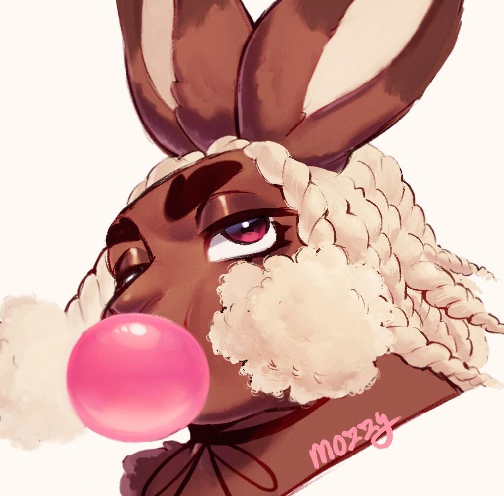 Mozzy looking at the viewer with a smile